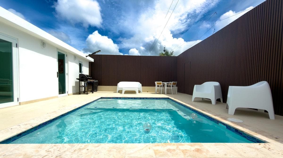 Pool area with seating. POOL is around 4'-5' deep
